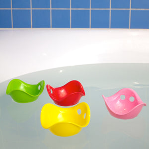 MINI Bilibo-gioco innovativo e versatile. In foto la Classic Collection. Mini Bilibo rosa, giallo, rosso e verde che galleggiano nella vasca