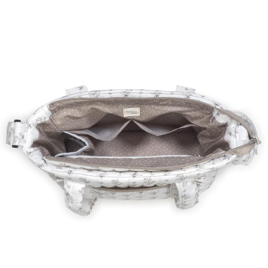 Visione dell'alto della borsa fasciatoio aperta con tasche interne di cui una grande plastificata e 1 tasca termica per biberon