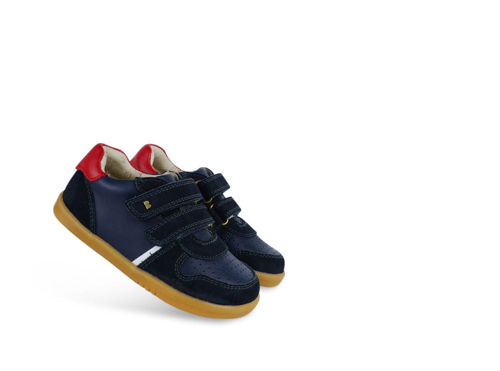 coppia di scarpe blu in pelle con inserto rosso e doppio strappo
