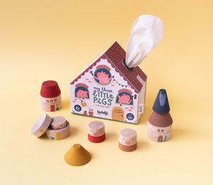 Scatola a forma di casetta di my 3 little pigs e pezzi di legno da impilare 