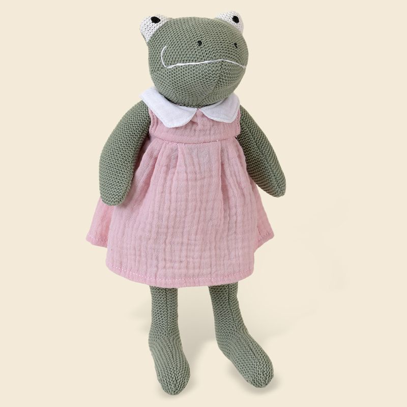 Ranocchia verde di peluche con elegante vestito rosa e colletto bianco