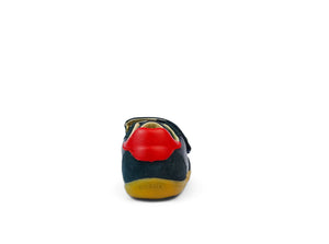 vista tallone colore blu con inserto rosso e suola marrone
