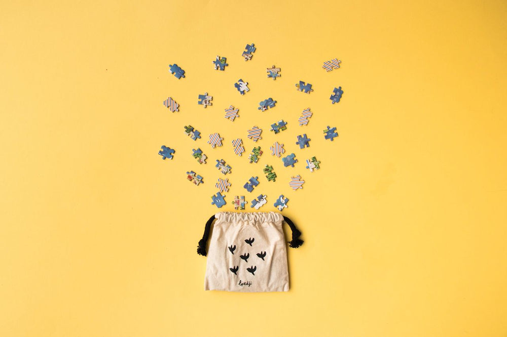 Sacchettino di stoffa che contiene i pezzi del puzzle