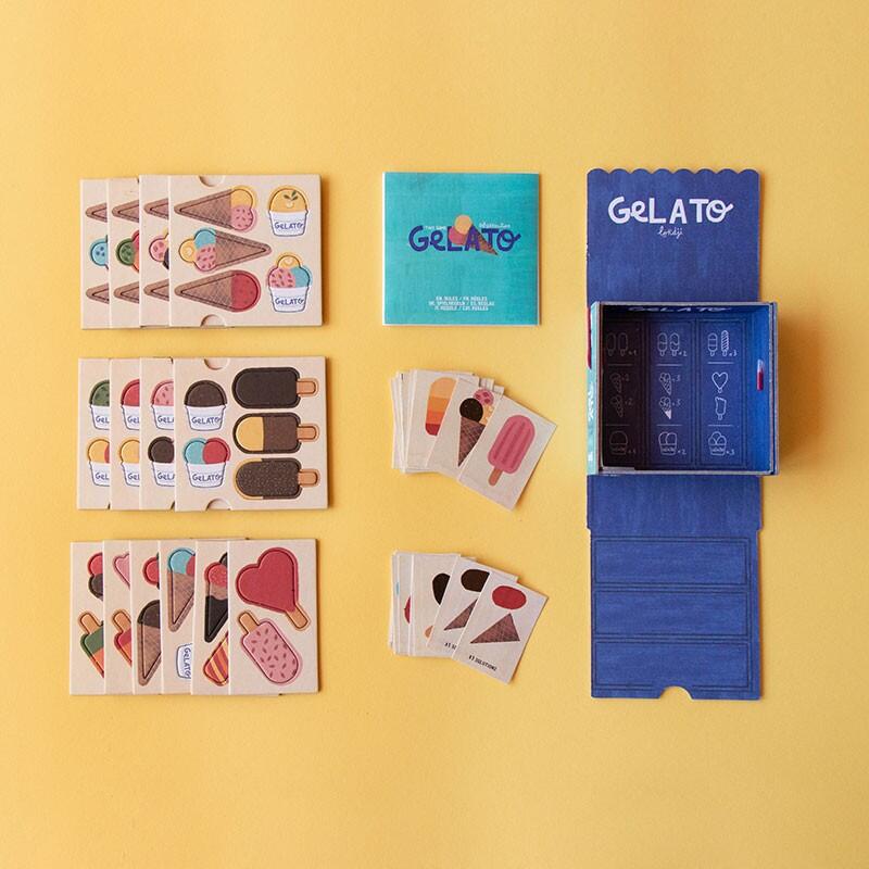 Interno della scatola Gelato e contenuto con 54 tesserine a forma di gelati e 45 schede gioco