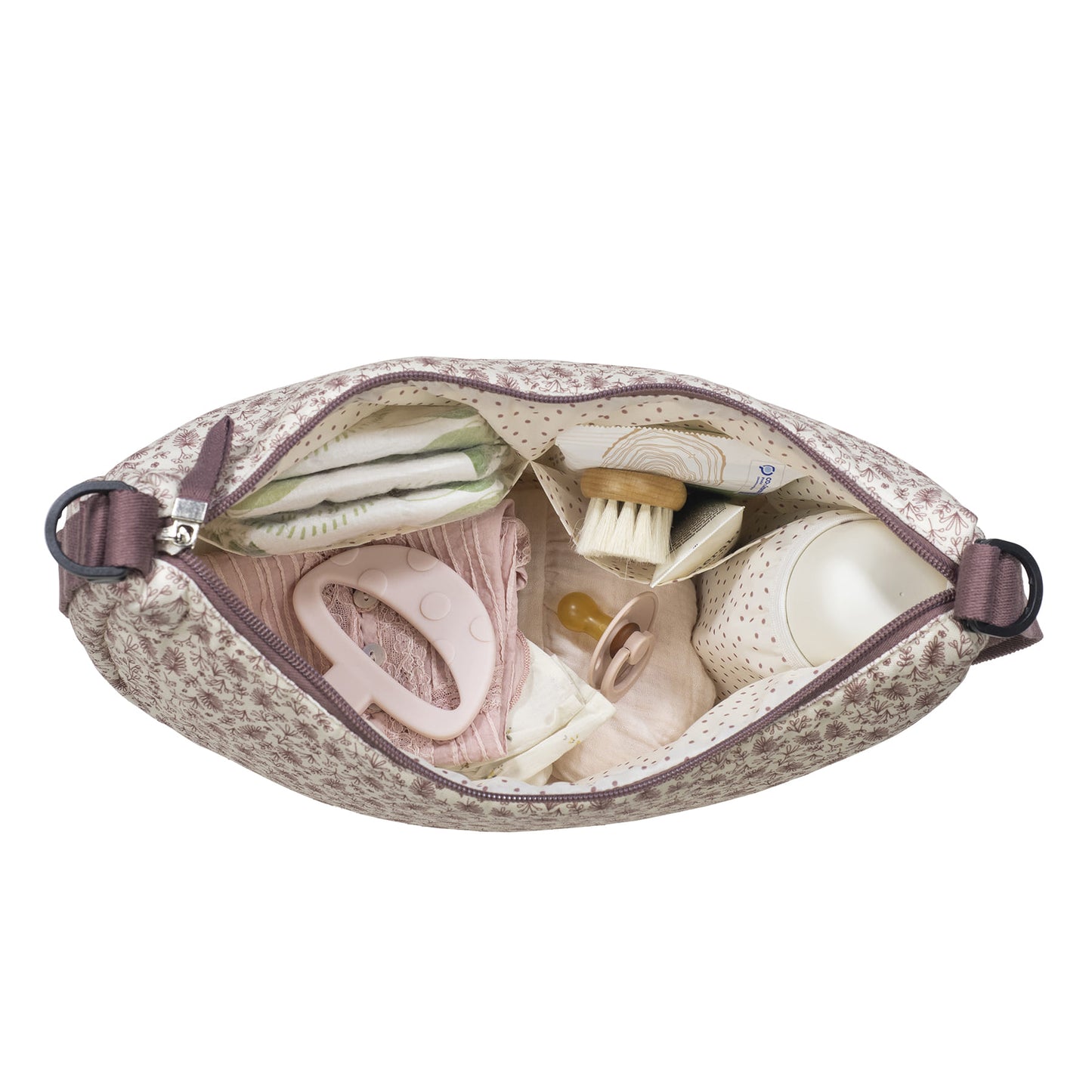 Visione dell'alto della borsa gongola cerise aperta con tutti gli oggetti del bimbo organizzati nelle tasche laterali