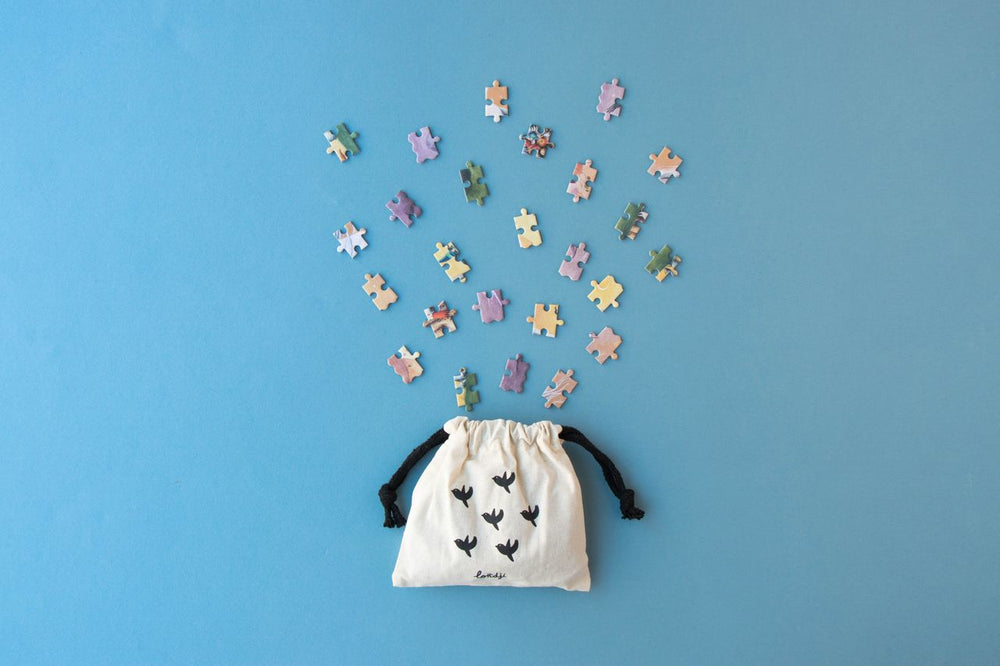 Sacchettinon di stoffa che contiene pezzi di puzzle <My Unicorn