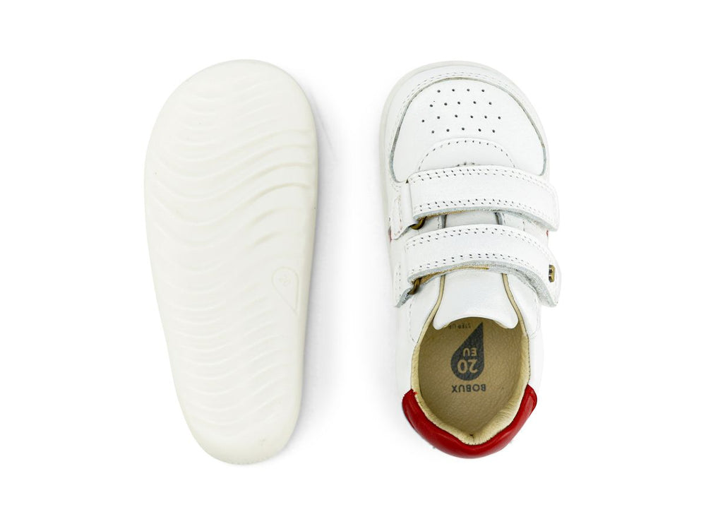 suola e partye superiore della scarpa bianca con forellini aerazione in punta e due strap, tallone rosso