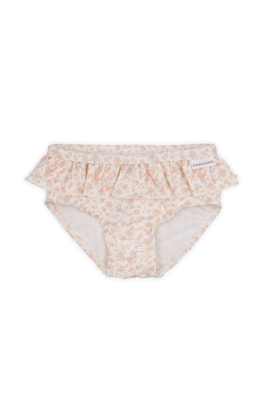 slip bimba con volant colore rosa chiaro e petali di fiore