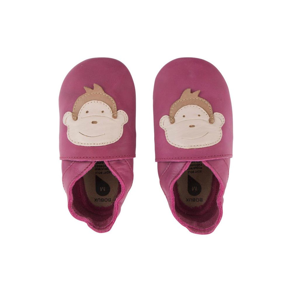 Bobux babbucce Soft Sole Scimmia Magenta. Babbuccia color magenta con stampa del volto di una scimmia.